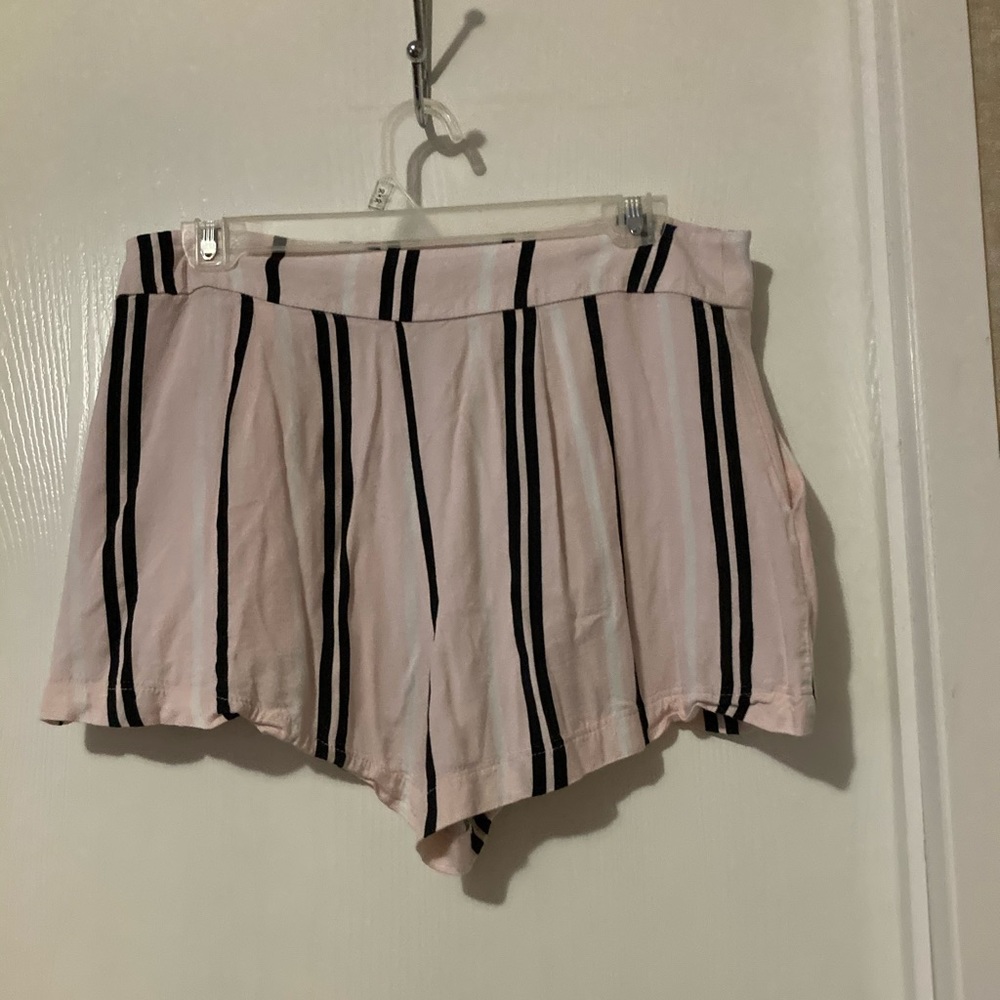 Pink and black and white striped shorts